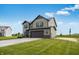 Charming two-story home with an attached two-car garage and a well-manicured lawn at 349 N Post Oak Dr, Mooresville, IN 46158