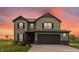 Beautiful two-story home with an attached garage, complemented by a sunrise background at 349 N Post Oak Dr, Mooresville, IN 46158