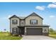 Two-story home with an attached garage, green siding, black shutters and a well-manicured lawn at 349 N Post Oak Dr, Mooresville, IN 46158