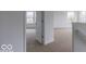 Carpeted hallway leading to a bedroom at 349 N Post Oak Dr, Mooresville, IN 46158