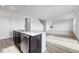 Bright, open kitchen with stainless steel appliances and hardwood floors at 349 N Post Oak Dr, Mooresville, IN 46158