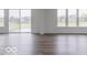 Bright living room with hardwood floors and sliding glass doors leading to patio at 349 N Post Oak Dr, Mooresville, IN 46158