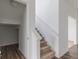 Modern staircase with carpet runner and access to upper level at 349 N Post Oak Dr, Mooresville, IN 46158