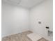 Utility room features durable wood-look flooring and essential laundry hookups at 349 N Post Oak Dr, Mooresville, IN 46158