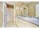 Bathroom showcases a double sink vanity and an adjacent shower behind a white door for comfort and privacy at 5030 Nightshade Ln, Noblesville, IN 46062