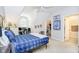 Bright bedroom with large window, desk, and en-suite bathroom access at 5030 Nightshade Ln, Noblesville, IN 46062
