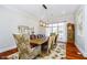 Elegant dining room featuring a wooden table, decorative chairs, and ample natural light at 5030 Nightshade Ln, Noblesville, IN 46062
