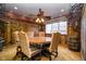 Unique dining room with wood floors, and a ceiling fan with chandelier at 5030 Nightshade Ln, Noblesville, IN 46062