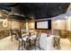 Home theater/entertainment room with a projector screen, custom lighting, and comfortable seating at 5030 Nightshade Ln, Noblesville, IN 46062
