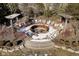 Outdoor fire pit surrounded by Adirondack chairs creates a welcoming space for gatherings and outdoor relaxation at 5030 Nightshade Ln, Noblesville, IN 46062