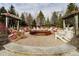 A gorgeous firepit surrounded by an array of chairs at 5030 Nightshade Ln, Noblesville, IN 46062