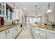 Gourmet kitchen with custom cabinetry, granite countertops, stainless steel appliances, and an oversized island at 5030 Nightshade Ln, Noblesville, IN 46062