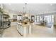 This spacious kitchen includes two islands, stainless steel appliances, and natural light at 5030 Nightshade Ln, Noblesville, IN 46062