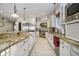 Spacious kitchen with a granite island, stainless steel appliances, and bright, modern lighting fixtures at 5030 Nightshade Ln, Noblesville, IN 46062