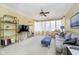 Inviting living room with ample natural light, a ceiling fan, and comfortable seating at 5030 Nightshade Ln, Noblesville, IN 46062