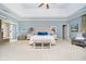 Large main bedroom showcasing tray ceiling, sitting area, and serene color palette at 5030 Nightshade Ln, Noblesville, IN 46062