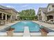 Beautiful in-ground pool with diving board, patio furniture, and meticulously manicured landscaping at 5030 Nightshade Ln, Noblesville, IN 46062