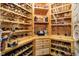 Custom wood wine cellar featuring individual bottle storage and display shelves at 5030 Nightshade Ln, Noblesville, IN 46062