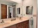 Clean bathroom with double sinks and a large mirror at 5299 Carnoustie Cir, Avon, IN 46123