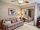 Cozy bedroom with a comfy sofa and mirrored closet doors at 5299 Carnoustie Cir, Avon, IN 46123
