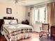 Charming bedroom with a quilt bedspread and hardwood floors at 5299 Carnoustie Cir, Avon, IN 46123