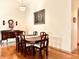 Elegant dining room featuring hardwood floors, a formal table, and artwork at 5299 Carnoustie Cir, Avon, IN 46123