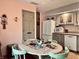Eat in kitchen with floral table and updated cabinets at 5299 Carnoustie Cir, Avon, IN 46123