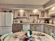 Galley kitchen with white appliances and updated cabinets at 5299 Carnoustie Cir, Avon, IN 46123