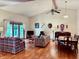 Vaulted ceiling living room with hardwood floors and dining area at 5299 Carnoustie Cir, Avon, IN 46123