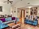 Bright living room with hardwood floors, ample seating, and a dining area at 5299 Carnoustie Cir, Avon, IN 46123