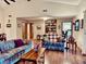 Spacious living room featuring hardwood floors, comfortable sofas, and built-in shelving at 5299 Carnoustie Cir, Avon, IN 46123