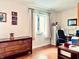 Home office featuring a large desk and built-in cabinets at 5299 Carnoustie Cir, Avon, IN 46123