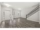Inviting entryway features a wood-look floor, and a view of the staircase and a bright window at 537 Steinbeck Pl, Carmel, IN 46032