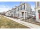 Attractive multi-story townhome with a mix of siding and stone facade, and dark shutters at 537 Steinbeck Pl, Carmel, IN 46032