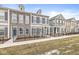 Beautiful multi-story townhomes with varied facades and complementary colors, and dark shutters at 537 Steinbeck Pl, Carmel, IN 46032