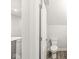 Modern powder room with a wood look floor and a water efficient toilet at 537 Steinbeck Pl, Carmel, IN 46032