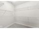 Spacious walk-in closet with multiple levels of wire shelving for ample storage at 537 Steinbeck Pl, Carmel, IN 46032