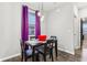 Dining room with a table and four chairs, and purple curtains at 6433 Wasco Dr, Whitestown, IN 46075