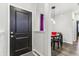 Bright entryway with dark door, purple curtain, and small dining area at 6433 Wasco Dr, Whitestown, IN 46075