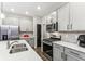 Modern kitchen with stainless steel appliances and an island at 6433 Wasco Dr, Whitestown, IN 46075