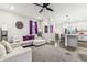 Spacious living room with L-shaped sofa, ceiling fan, and open floor plan at 6433 Wasco Dr, Whitestown, IN 46075