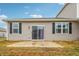 Private patio with sliding glass doors and small yard at 6433 Wasco Dr, Whitestown, IN 46075