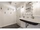 Elegant bathroom includes a trough sink, subway tile walls, and stylish fixtures at 7341 Washington Blvd, Indianapolis, IN 46240