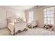 Bedroom featuring two beds, and two large windows with plenty of natural light at 7341 Washington Blvd, Indianapolis, IN 46240