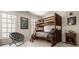 Bedroom featuring built in bunkbeds and multiple large windows for natural light at 7341 Washington Blvd, Indianapolis, IN 46240