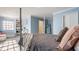 Bedroom featuring four poster bed and a separate desk area near large window at 7341 Washington Blvd, Indianapolis, IN 46240