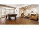 Entertainment area boasting a pool table, natural light, hardwood floors and comfortable seating at 7341 Washington Blvd, Indianapolis, IN 46240