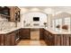 Sophisticated kitchen with custom cabinetry, stainless steel appliances, and hardwood floors at 7341 Washington Blvd, Indianapolis, IN 46240