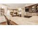 Spacious kitchen features an island with granite countertops and high-end stainless steel appliances at 7341 Washington Blvd, Indianapolis, IN 46240