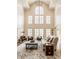 Bright living room featuring cathedral ceilings, an oversized window, and plush seating at 7341 Washington Blvd, Indianapolis, IN 46240